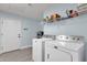 Laundry room with washer, dryer and storage at 2366 E Becker Ln, Phoenix, AZ 85028