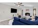 Living room featuring a white brick fireplace and a navy sectional sofa at 2366 E Becker Ln, Phoenix, AZ 85028