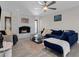 Living room with navy sectional sofa and whitewashed brick fireplace at 2366 E Becker Ln, Phoenix, AZ 85028