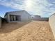 Spacious dirt backyard surrounded by block wall fencing at 2446 E Spur Dr, San Tan Valley, AZ 85140