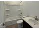 Clean bathroom design featuring a tub, shower, and dark cabinets at 2446 E Spur Dr, San Tan Valley, AZ 85140