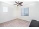 Bright bedroom with carpet, window blinds, and ceiling fan at 25210 N 54Th Dr, Phoenix, AZ 85083