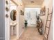 Entryway with console table, mirror, and view of powder room at 25210 N 54Th Dr, Phoenix, AZ 85083