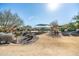 Community playground with play structures, shade cover, and benches at 25210 N 54Th Dr, Phoenix, AZ 85083