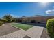 Landscaped backyard with artificial turf at 25973 W Horsham Dr, Buckeye, AZ 85396