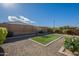 Landscaped backyard with artificial turf at 25973 W Horsham Dr, Buckeye, AZ 85396