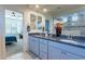 Main bathroom with double sinks and a view of the bedroom at 25973 W Horsham Dr, Buckeye, AZ 85396