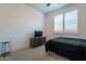 Simple bedroom with a double bed and media console at 25973 W Horsham Dr, Buckeye, AZ 85396