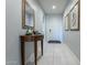 Bright entry hall with tile flooring and a console table at 25973 W Horsham Dr, Buckeye, AZ 85396