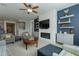 Living room with a fireplace and built-in shelving at 25973 W Horsham Dr, Buckeye, AZ 85396