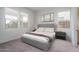 Well-lit bedroom featuring a gray upholstered bed at 2700 N 216Th Ave, Buckeye, AZ 85396