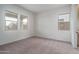 Spacious bedroom with carpet and large windows at 2700 N 216Th Ave, Buckeye, AZ 85396