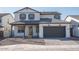 Charming two-story home featuring a two car garage and a well manicured yard with desert landscaping at 2700 N 216Th Ave, Buckeye, AZ 85396