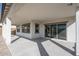 Covered patio with concrete flooring and sliding glass door access at 2700 N 216Th Ave, Buckeye, AZ 85396