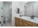 Double vanity bathroom with a large mirror and walk in shower at 2732 N 217Th Ave, Buckeye, AZ 85396