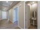 Modern powder room with pedestal sink and round mirror at 2732 N 217Th Ave, Buckeye, AZ 85396