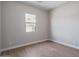 Simple bedroom with wood-look floors and window at 2732 N 217Th Ave, Buckeye, AZ 85396