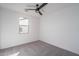 Bright bedroom with ceiling fan and neutral carpeting at 2732 N 217Th Ave, Buckeye, AZ 85396