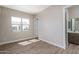 Bright bedroom with wood-look floors and window at 2732 N 217Th Ave, Buckeye, AZ 85396