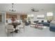 Open concept dining area with modern light fixtures and seating for four at 2732 N 217Th Ave, Buckeye, AZ 85396