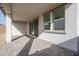 Covered patio with paver stones and sliding glass door access at 2732 N 217Th Ave, Buckeye, AZ 85396