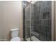 Shower stall with dark tile and glass door at 2732 N 217Th Ave, Buckeye, AZ 85396