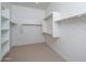 Large walk-in closet with shelving and hanging rods at 2732 N 217Th Ave, Buckeye, AZ 85396