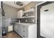 Updated laundry room with white cabinets and a built-in pet door at 3105 N 21St St, Phoenix, AZ 85016