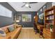 Mid-century modern home office with a leather couch, wood desk, and built-in shelves at 3105 N 21St St, Phoenix, AZ 85016