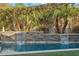 Relaxing waterfall feature adjacent to a refreshing pool at 3105 N 21St St, Phoenix, AZ 85016