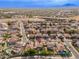 Aerial view of house and surrounding neighborhood with mountains in the background at 3552 E Claxton Ave, Gilbert, AZ 85297