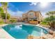 Home with sparkling pool, patio, and lush landscaping at 3552 E Claxton Ave, Gilbert, AZ 85297