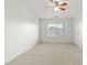 Spacious bedroom with a ceiling fan and window coverings at 3552 E Claxton Ave, Gilbert, AZ 85297