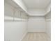 Walk-in closet with ample shelving at 3552 E Claxton Ave, Gilbert, AZ 85297