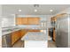 Modern kitchen with granite countertops and stainless steel appliances at 3552 E Claxton Ave, Gilbert, AZ 85297