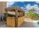 Charming outdoor tiki bar with string lights and a fun atmosphere at 3552 E Claxton Ave, Gilbert, AZ 85297