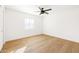 Simple bedroom with wood flooring and window with blinds at 3810 E Shea Blvd, Phoenix, AZ 85028