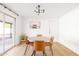 Modern dining room with light wood floors and a round table with four chairs at 3810 E Shea Blvd, Phoenix, AZ 85028