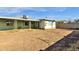 View of backyard, house exterior, and block wall at 3821 W Verde Ln, Phoenix, AZ 85019