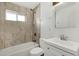 Updated bathroom with a new vanity and tiled shower at 3821 W Verde Ln, Phoenix, AZ 85019