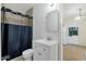 Clean bathroom featuring a shower, toilet and vanity with sink at 3821 W Verde Ln, Phoenix, AZ 85019