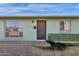 House entrance with a metal door and light green brick at 3821 W Verde Ln, Phoenix, AZ 85019