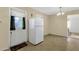 Kitchen with white door, white fridge and linoleum floor at 3821 W Verde Ln, Phoenix, AZ 85019