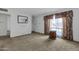 Living room with carpeted floors and a simple decor at 3821 W Verde Ln, Phoenix, AZ 85019