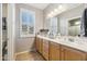 Clean bathroom with double vanity and light wood cabinets at 4364 E Selena Dr, Phoenix, AZ 85050