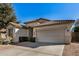 House exterior showcasing a two-car garage and well-maintained landscaping at 4795 E Bellerive Dr, Chandler, AZ 85249