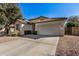 House exterior showcasing a two-car garage and well-maintained landscaping at 4795 E Bellerive Dr, Chandler, AZ 85249