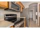 Stainless steel appliances including a microwave, stovetop, and oven at 4795 E Bellerive Dr, Chandler, AZ 85249