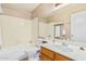 Well-lit bathroom featuring a sink, toilet, bathtub, and decorative mirror at 5121 W Jupiter Way, Chandler, AZ 85226