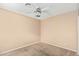 A simple bedroom featuring a ceiling fan and neutral walls at 5121 W Jupiter Way, Chandler, AZ 85226